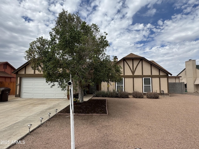 12512 N 85th Ave, Peoria, AZ 85381 - english style home featuring driveway, stucco siding, and a garage