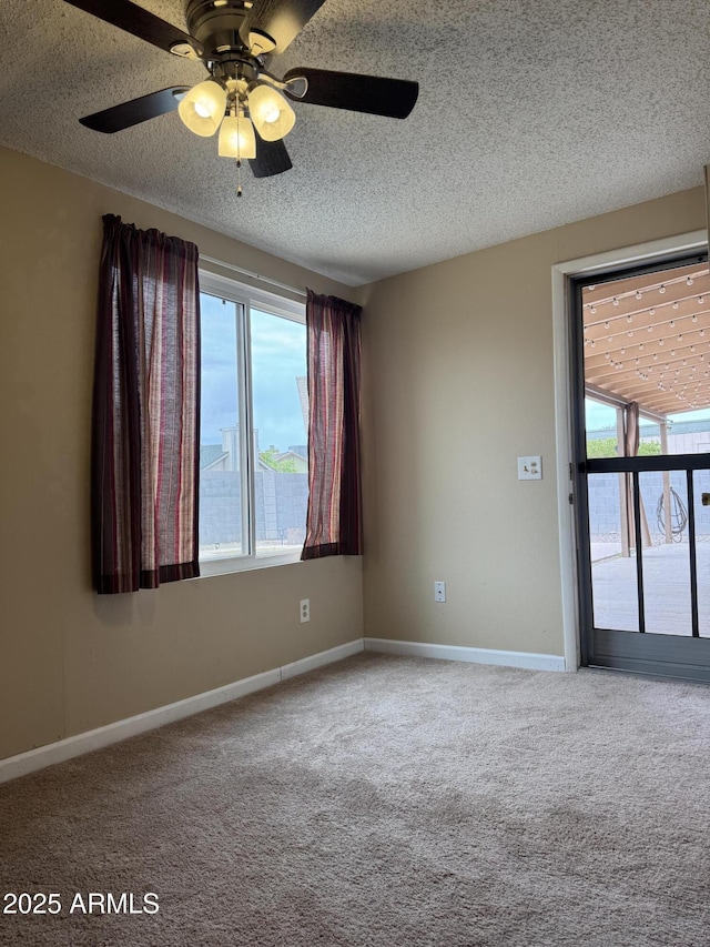 12512 N 85th Ave, Peoria, AZ 85381 - empty room featuring carpet floors, a textured ceiling, a ceiling fan, and baseboards