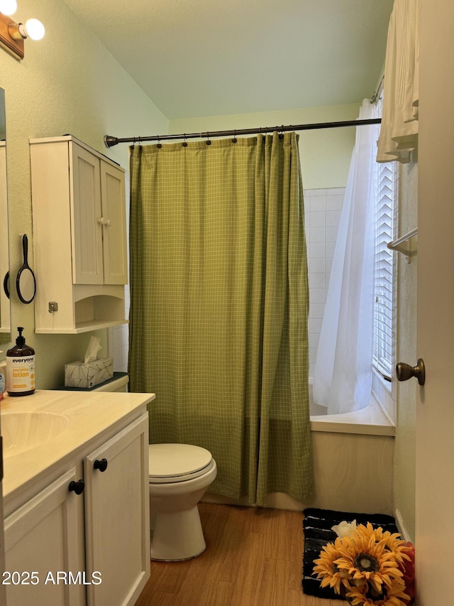 12512 N 85th Ave, Peoria, AZ 85381 - bathroom featuring vanity, shower / tub combo with curtain, wood finished floors, and toilet