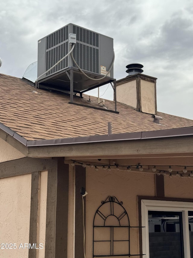 12512 N 85th Ave, Peoria, AZ 85381 - exterior view of a shingled roof and central air condition unit