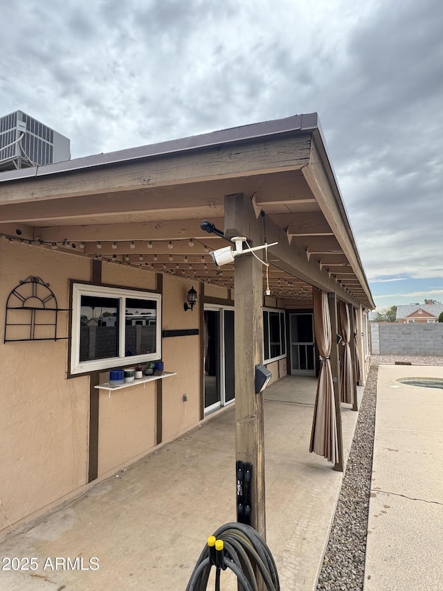 12512 N 85th Ave, Peoria, AZ 85381 - view of patio / terrace featuring central air condition unit and a sink