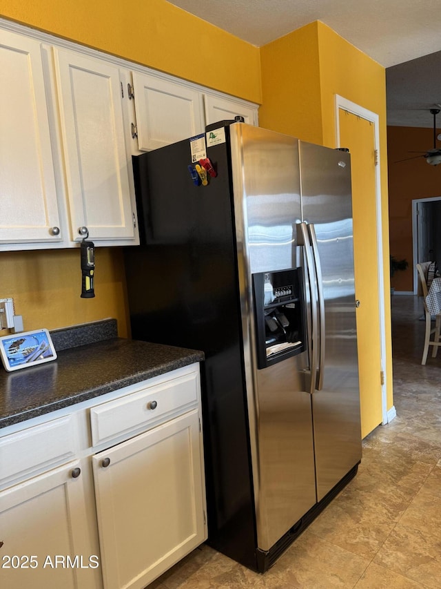 12512 N 85th Ave, Peoria, AZ 85381 - kitchen with stainless steel fridge with ice dispenser, white cabinets, dark countertops, and ceiling fan