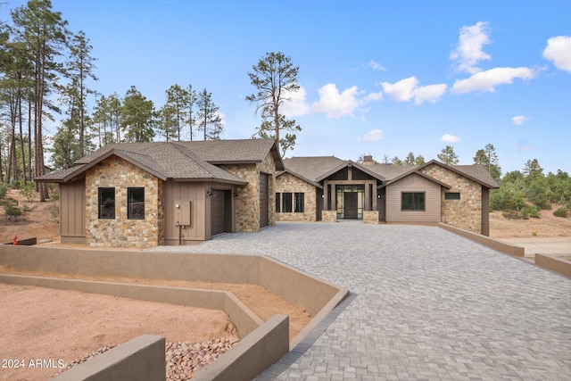 1804 E Senna Pt, Payson, AZ 85541 - ranch-style house featuring roof with shingles, stone siding, a garage, decorative driveway, and board and batten siding