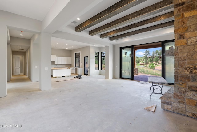 living room featuring beam ceiling