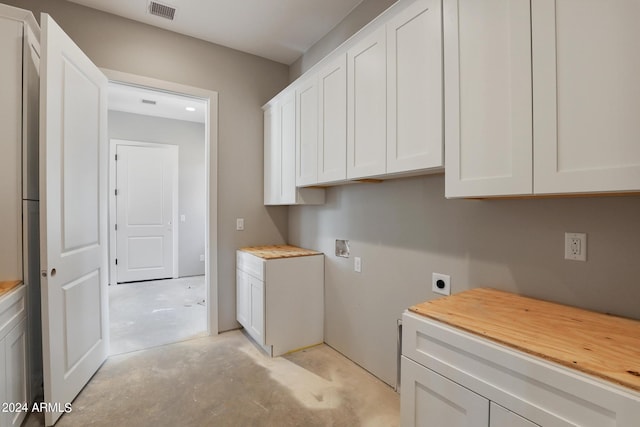 washroom featuring cabinets, hookup for an electric dryer, and hookup for a washing machine