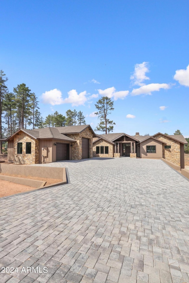 1804 E Senna Pt, Payson, AZ 85541 - prairie-style house featuring stone siding, decorative driveway, and a garage