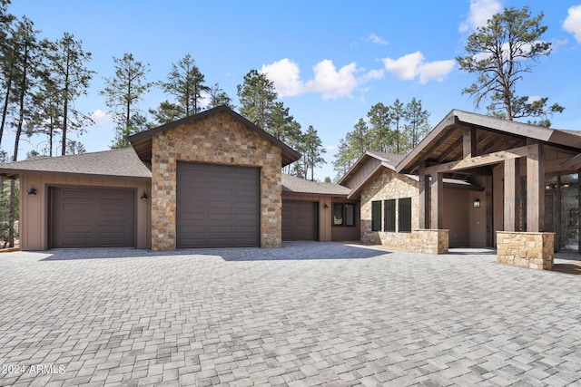 1804 E Senna Pt, Payson, AZ 85541 - view of front of house with stone siding, a shingled roof, a garage, and decorative driveway