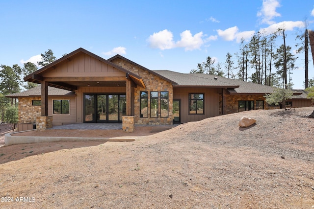1804 E Senna Pt, Payson, AZ 85541 - back of property featuring roof with shingles, a patio, stone siding, and board and batten siding