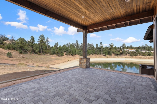 view of patio / terrace with a water view