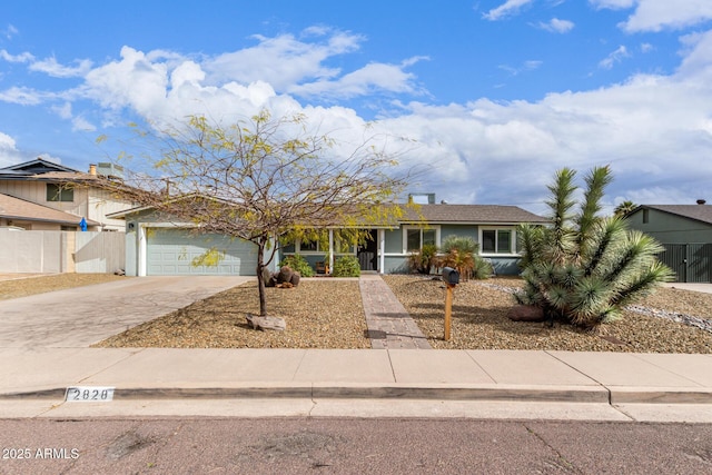 ranch-style house with stucco siding, concrete driveway, a garage, and fence