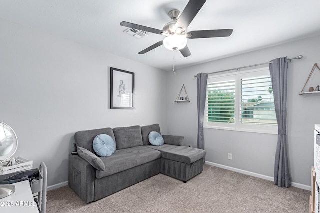 living area featuring light carpet, visible vents, baseboards, and a ceiling fan