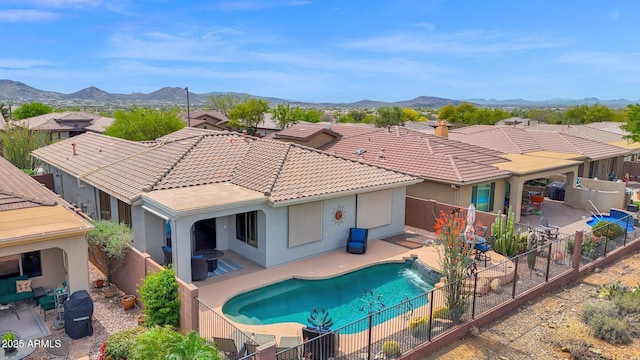 2452 W Muirfield Dr, Anthem, AZ 85086 - view of swimming pool with a fenced backyard, a patio, a mountain view, and a fenced in pool