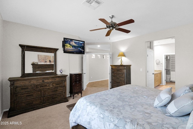 2452 W Muirfield Dr, Anthem, AZ 85086 - bedroom featuring ensuite bath, visible vents, a ceiling fan, and light colored carpet