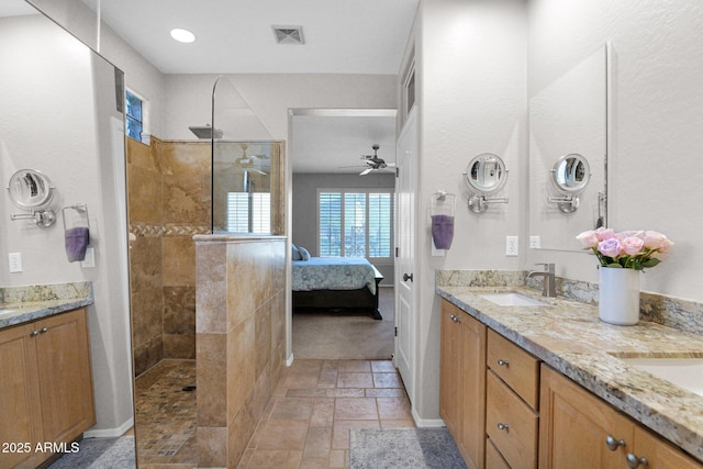 2452 W Muirfield Dr, Anthem, AZ 85086 - ensuite bathroom with visible vents, a sink, double vanity, and walk in shower