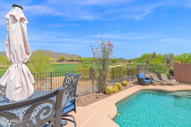 2452 W Muirfield Dr, Anthem, AZ 85086 - view of swimming pool with a fenced backyard, a patio area, a mountain view, and a fenced in pool