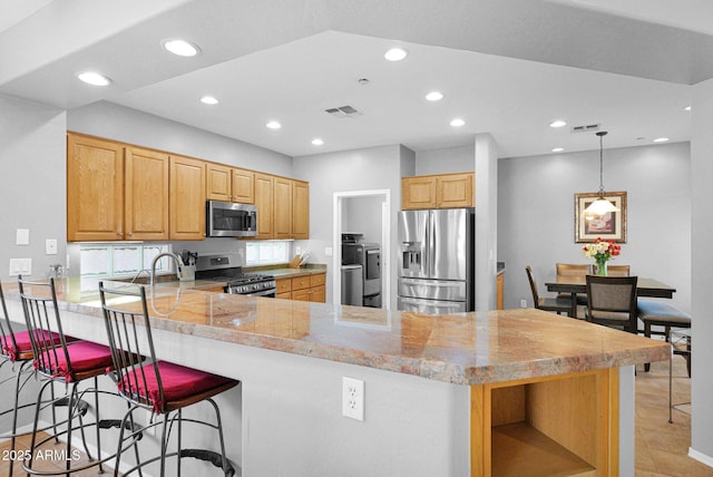 2452 W Muirfield Dr, Anthem, AZ 85086 - kitchen featuring open shelves, recessed lighting, visible vents, a peninsula, and appliances with stainless steel finishes