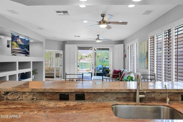 2452 W Muirfield Dr, Anthem, AZ 85086 - kitchen with open floor plan, recessed lighting, ceiling fan, and a sink