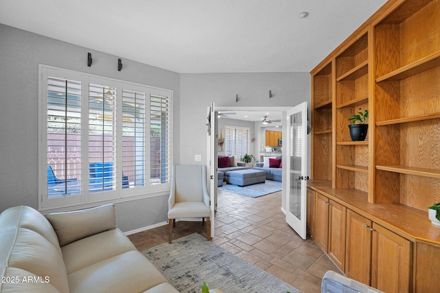 2452 W Muirfield Dr, Anthem, AZ 85086 - living area with baseboards and a ceiling fan