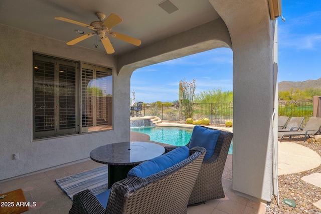 2452 W Muirfield Dr, Anthem, AZ 85086 - view of patio / terrace featuring ceiling fan, fence, and a fenced in pool