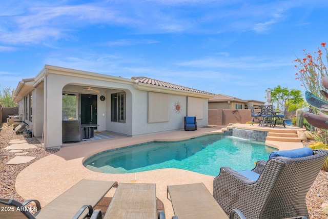 2452 W Muirfield Dr, Anthem, AZ 85086 - view of swimming pool with fence, a patio, a fenced in pool, outdoor dining space, and a ceiling fan