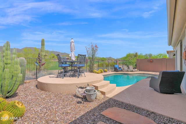 2452 W Muirfield Dr, Anthem, AZ 85086 - view of swimming pool featuring a fenced in pool, a fenced backyard, and a patio area