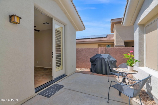 2452 W Muirfield Dr, Anthem, AZ 85086 - view of patio with a grill, fence, and visible vents