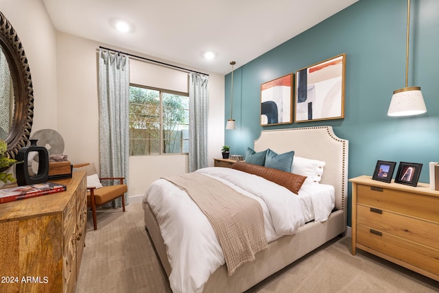 bedroom featuring light carpet and recessed lighting