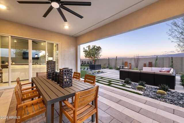 view of patio with ceiling fan, outdoor dining area, outdoor lounge area, and a fenced backyard