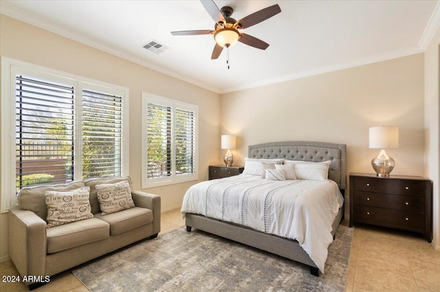 tiled bedroom with ornamental molding and ceiling fan