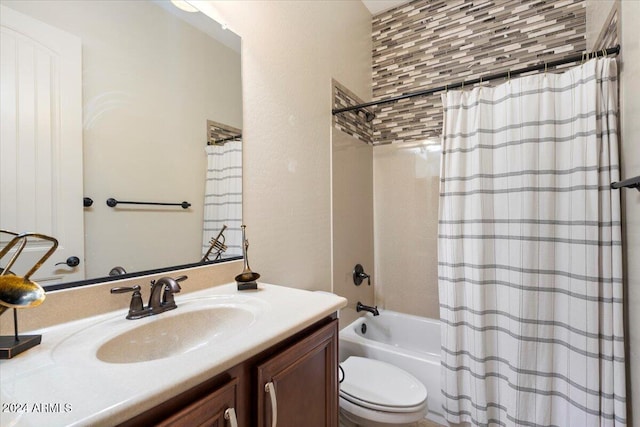 full bathroom featuring vanity, toilet, and shower / tub combo with curtain