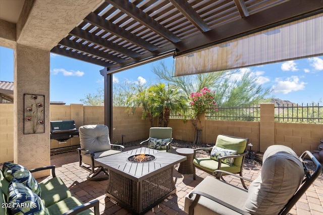 view of patio / terrace with area for grilling, an outdoor living space with a fire pit, and a pergola