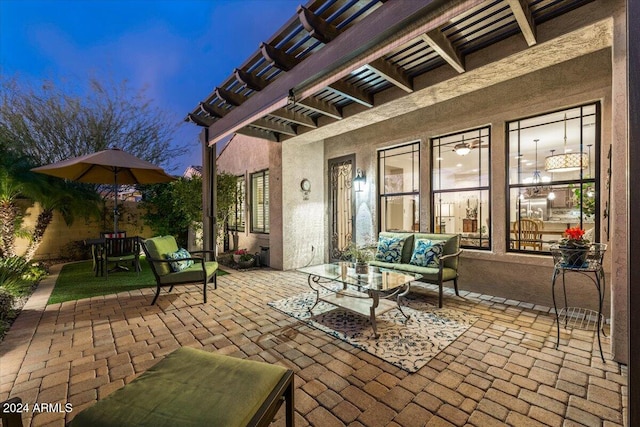 patio terrace at dusk featuring an outdoor living space