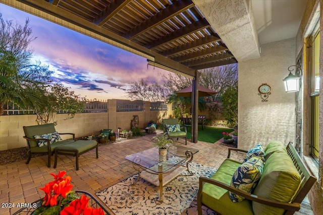 patio terrace at dusk with a pergola