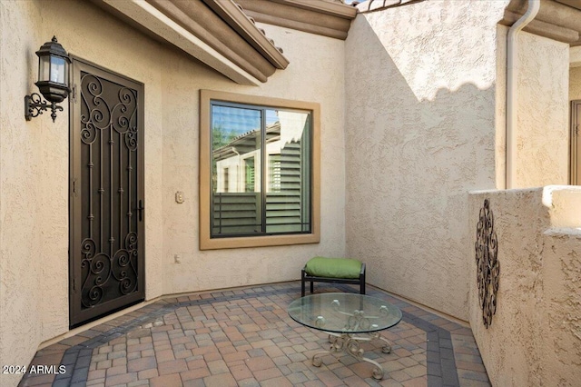 doorway to property featuring a patio