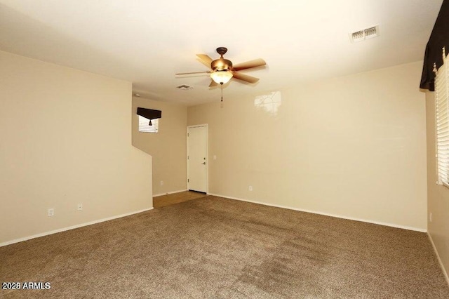 carpeted empty room with ceiling fan