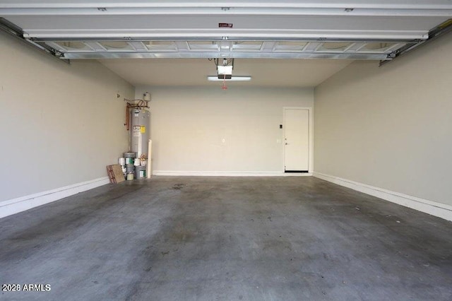 garage with a garage door opener and gas water heater