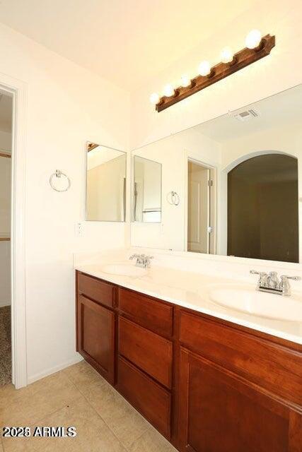 bathroom featuring tile patterned floors and vanity