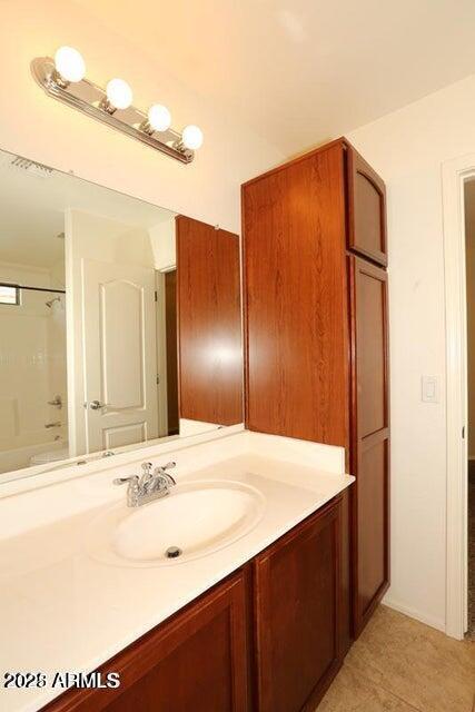 bathroom with tub / shower combination and vanity