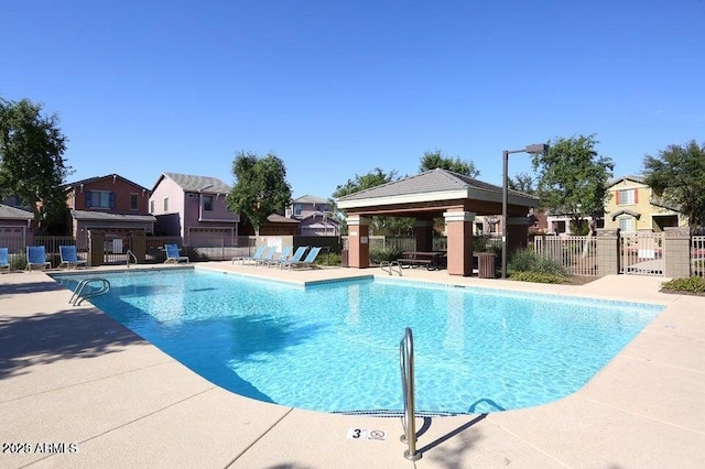 view of swimming pool featuring a patio and a gazebo