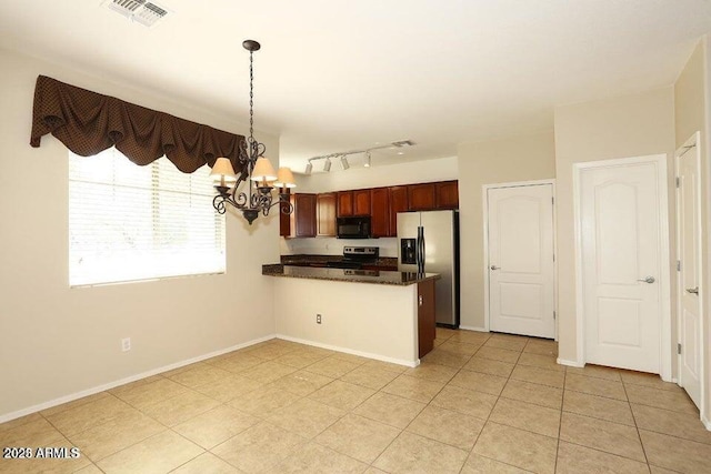 kitchen with hanging light fixtures, light tile patterned floors, kitchen peninsula, an inviting chandelier, and stainless steel appliances