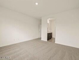 unfurnished living room featuring carpet floors