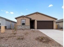 ranch-style home featuring a garage