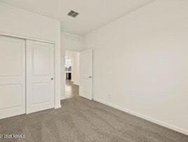 unfurnished bedroom with a closet