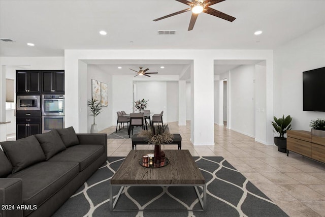 11856 W Lone Tree Trl, Peoria, AZ 85383 - living room with ceiling fan, recessed lighting, light tile patterned flooring, and baseboards