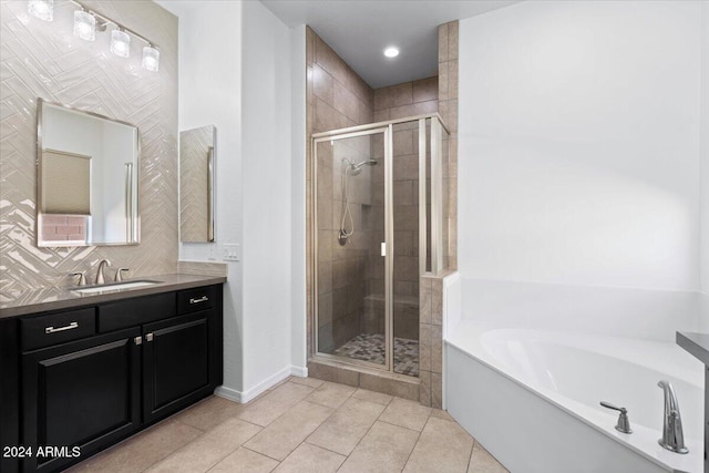 bathroom with vanity, shower with separate bathtub, and tile patterned flooring