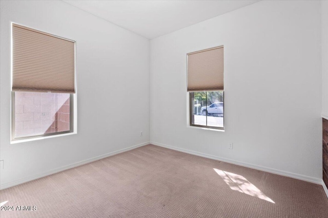 11856 W Lone Tree Trl, Peoria, AZ 85383 - spare room featuring carpet floors and baseboards