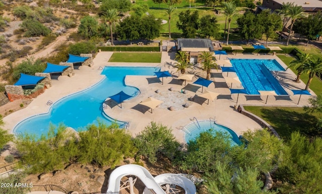 view of swimming pool with a patio