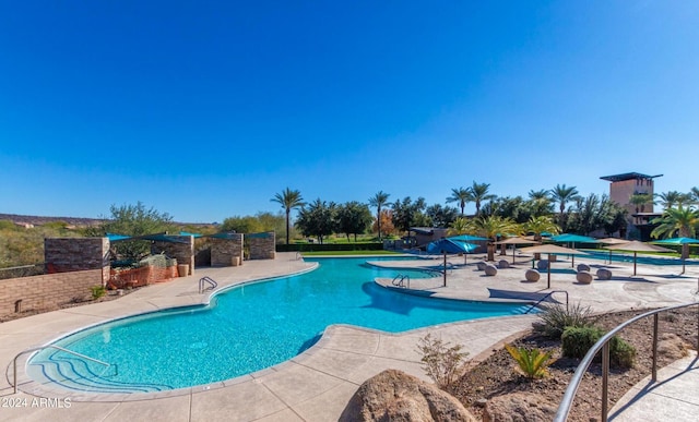 view of swimming pool featuring a patio