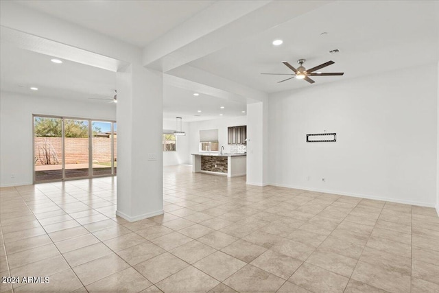 11856 W Lone Tree Trl, Peoria, AZ 85383 - unfurnished living room featuring ceiling fan, light tile patterned flooring, recessed lighting, baseboards, and a sink