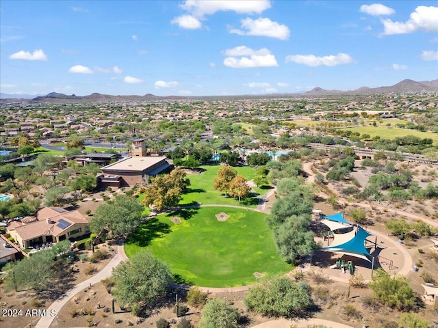 birds eye view of property with a mountain view